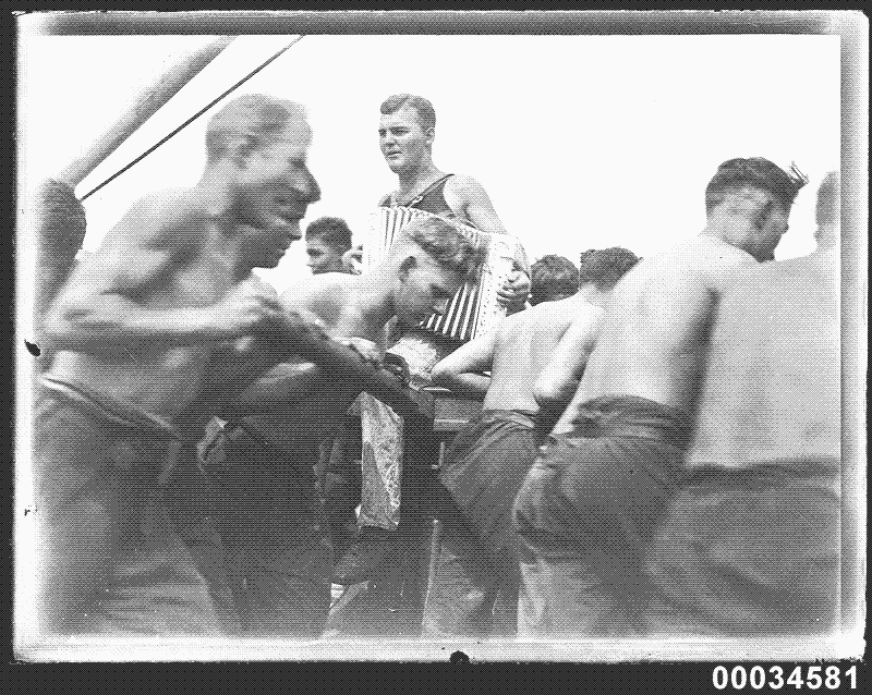 sailors using a capstan to lift sails aboard the Magdalene Vinnen photo part of the Samuel J. Hood Studio collection of the Australian Maritime Museum