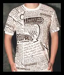 A boy standing in a shirt with wikipedia entries and captions printed all over it.