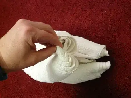 Image titled Pull towel ends apart.