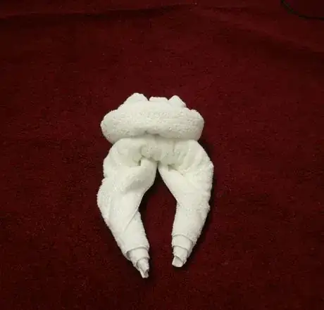 Image titled One roll tucked under the other.