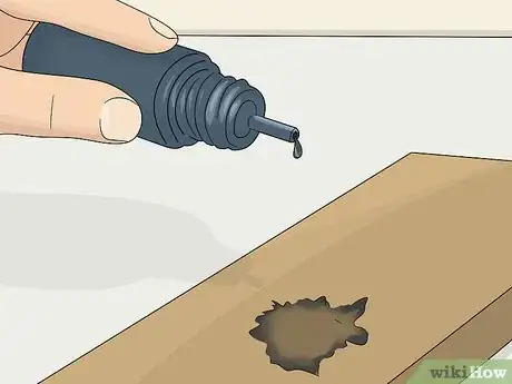 Image titled Paint Fake Knots in Wood Step 4