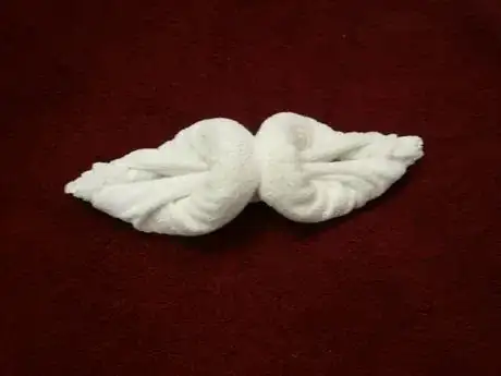 Image titled Lay it down with rolled sides facing up.