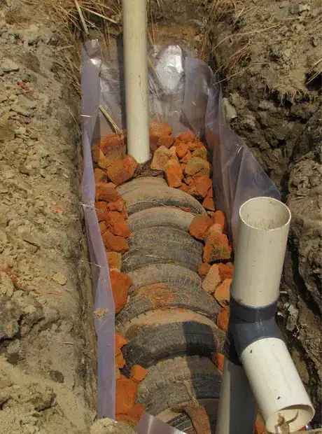 Image titled 6 broken brick border to hold in place the tire tank IMG_4396