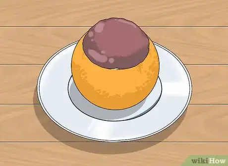 Image titled Bake a Cake Inside a Hollowed Orange over a Campfire Step 12