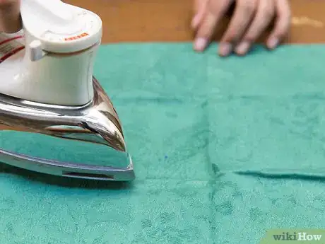 Image titled Fold a Napkin Like a Boat Step 4