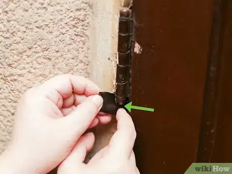 Image titled Hold a Door Open with a Coin Step 4