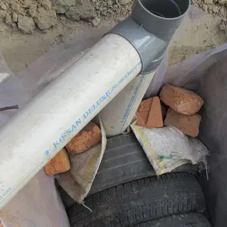 Image titled 5.1 block tire front stand pipe hole with plastic and brick to hold in place. close off the tank to protect itIMG_0457