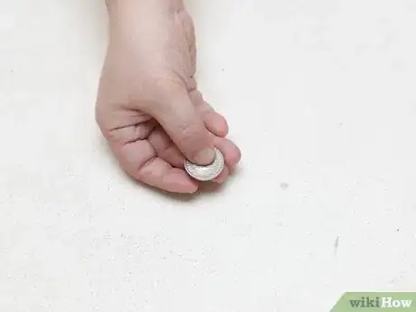 Image titled Hold a Door Open with a Coin Step 1