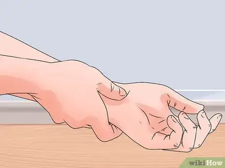 Image titled Respond to a Heart Attack Step 3