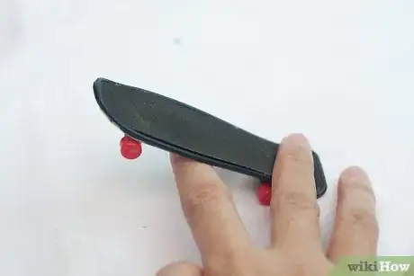 Image titled Do a Truckstand on a Tech Deck Step 4