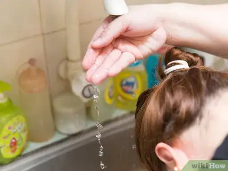 Image titled Put on a Swim Cap Step 2