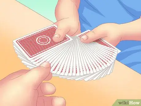 Image titled Make a Card Fall Through a Table Step 1