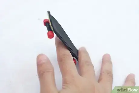 Image titled Do a Truckstand on a Tech Deck Step 5