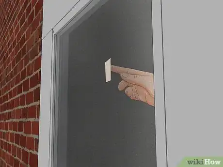 Image titled Hang a Wreath on a Storm Door Step 13