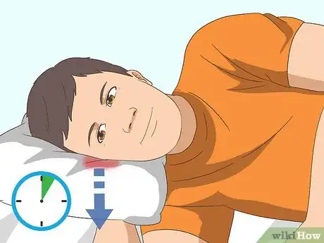 Image titled Remove Water from Ears Step 7