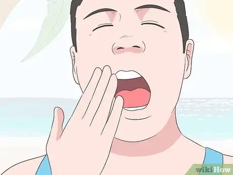 Image titled Remove Water from Ears Step 9