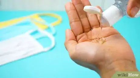 Image titled Properly Take Off a Face Mask Step 1