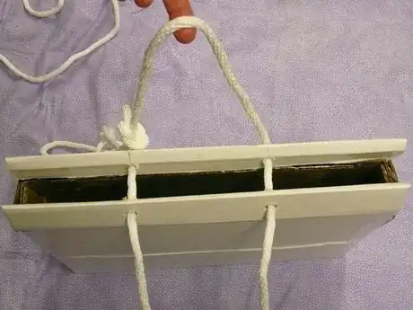 Image titled Alternate view with "handles" made by sliding the rope through the holes.