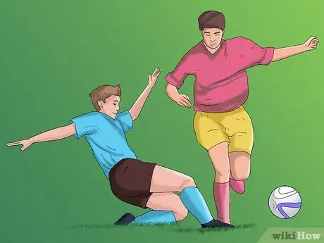 Image titled Slide Tackle in Football_Soccer Step 4