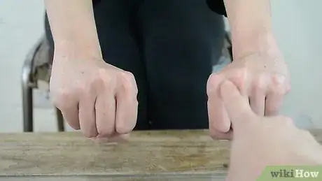 Image titled Do a Simple Coin Magic Trick Step 4