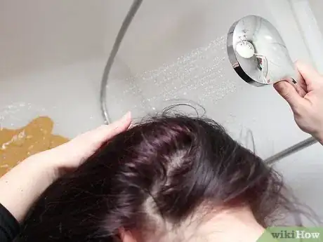 Image titled Do a Bun Mohawk Step 1