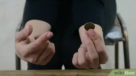 Image titled Do a Simple Coin Magic Trick Step 1