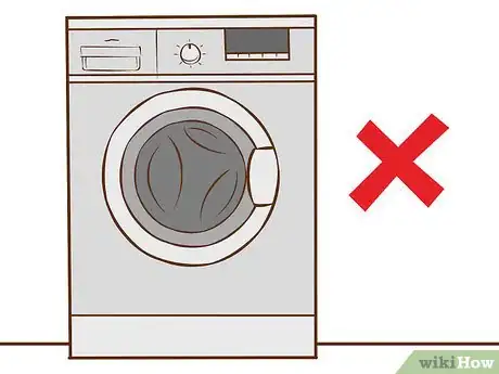 Image titled Remove Coloring Washed in to Clothes Step 1