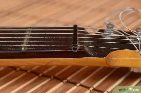 Image titled Make an Electric Guitar Into a Lap Steel Guitar Step 3