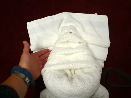 Image titled Tuck pleats under the tail to form the "legs".