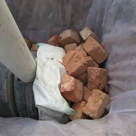 Image titled 5.2 close of the bakcstand pipe and broken bricks to hold in placeIMG_0464