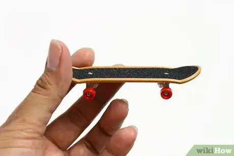 Image titled Take Griptape Off of a Tech Deck Step 1