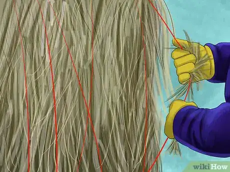 Image titled Cut and Gather String or Net Wrap Off of Round Bales Step 3