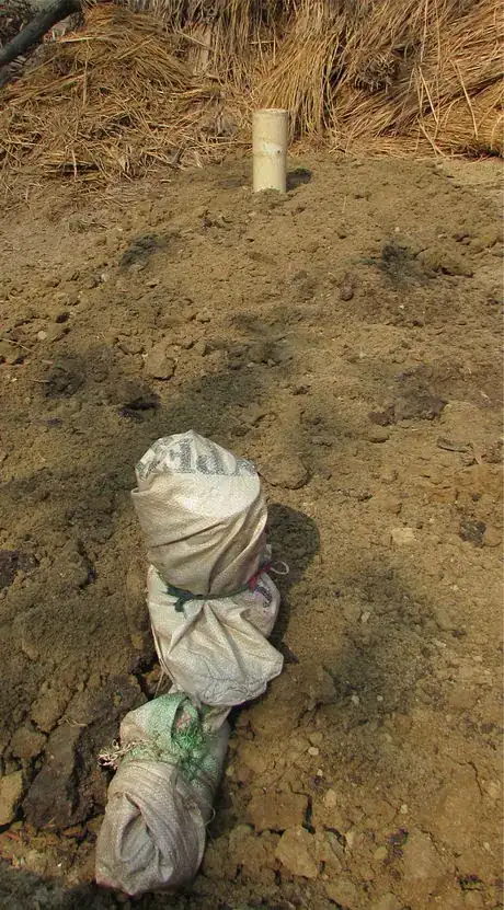 Image titled 11 fill and even out with soil IMG_4413