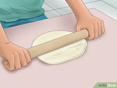 Image titled Make a 3D Dinosaur Birthday Cake Step 12