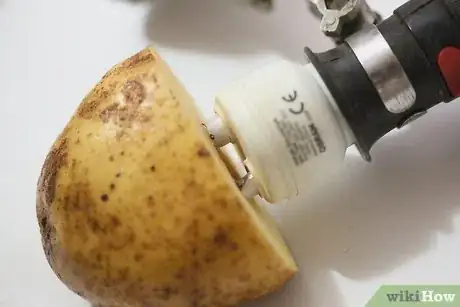 Image titled Remove a Broken Light Bulb with a Potato Step 4