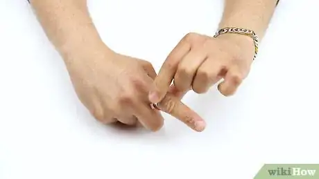 Image titled Remove a Stuck Ring Step 1