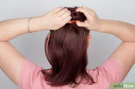 Image titled Do Curls with a Flat Iron Step 3