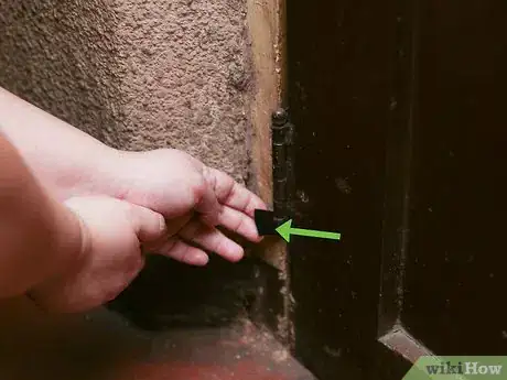 Image titled Hold a Door Open with a Coin Step 5