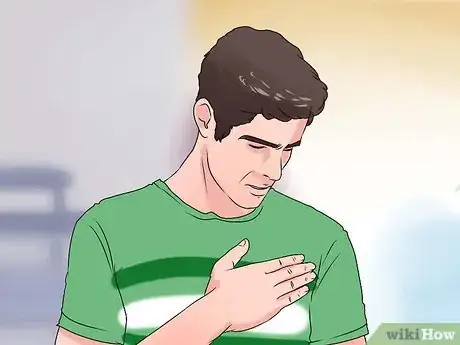 Image titled Respond to a Heart Attack Step 1
