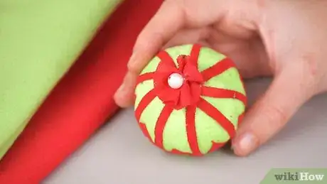 Image titled Make an Elegant No‐Sew Fabric Ball Christmas Ornament Step 7