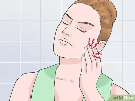 Image titled Deal With a Sore Tooth Step 1