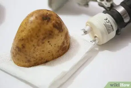 Image titled Remove a Broken Light Bulb with a Potato Step 3Bullet1