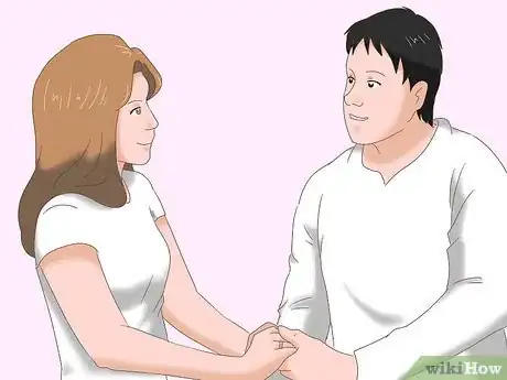 Image titled Hug Another Woman in Front of Your Wife or Girlfriend Step 1