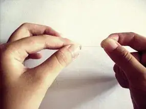 Image titled Hold between thumb and forefinger Step 2