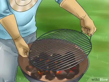 Image titled Start a Charcoal Fire With a Chimney Starter Step 3