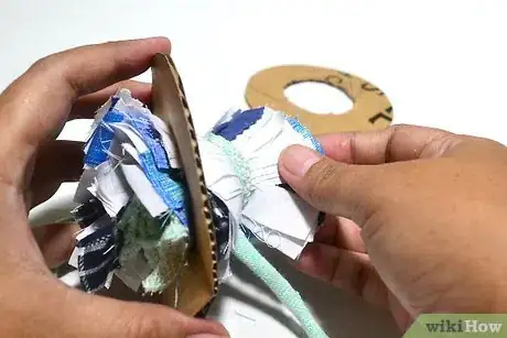Image titled Make Scrap Fabric Pom Poms Step 7