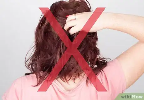 Image titled Do Curls with a Flat Iron Step 9