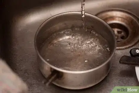 Image titled Stop Skin Forming on Milk Step 5