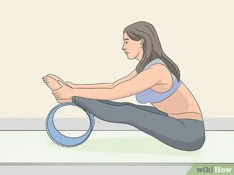 Image titled Use a Yoga Wheel Step 4