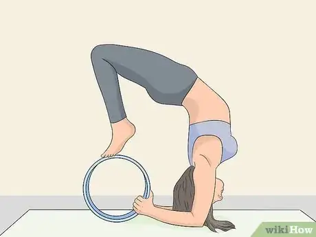Image titled Use a Yoga Wheel Step 3